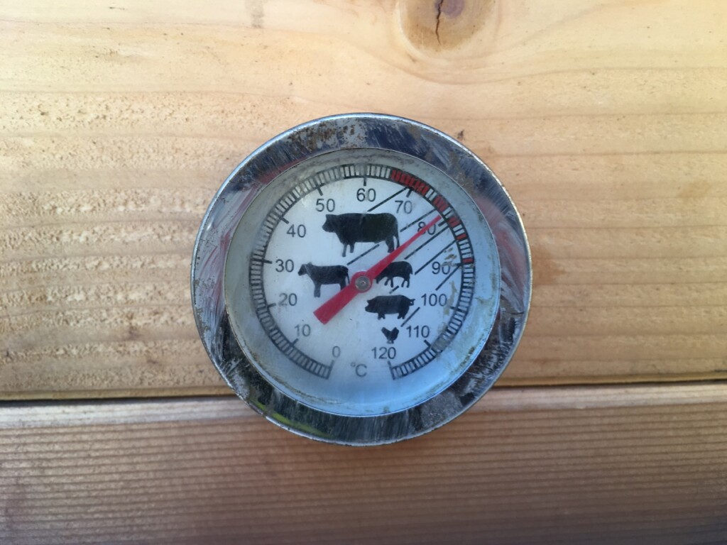 A thermometer in a smokehouse